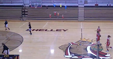 A women’s basketball game in a school court
