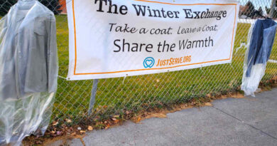 The Winter Exchange banner on a fence