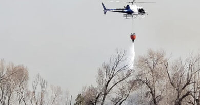 A helicopter dousing fire