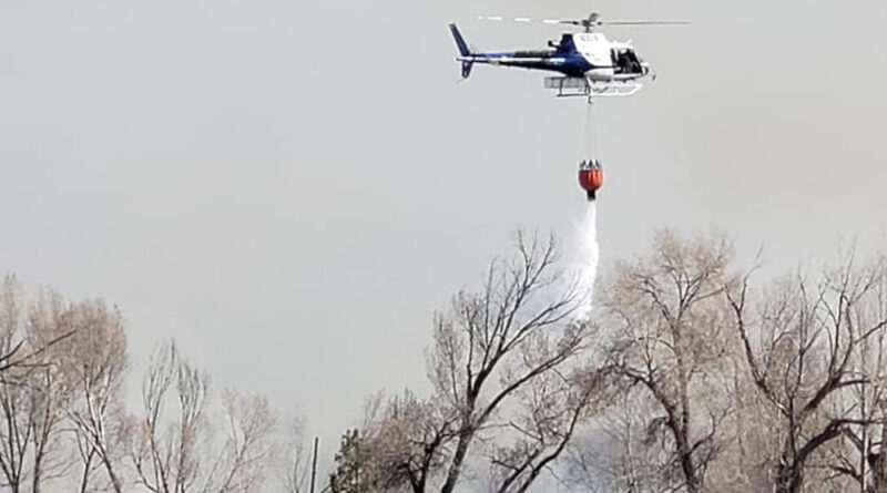 A helicopter dousing fire