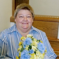 A woman holding a bouquet of flowers