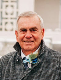 An elderly man with a gray apparel