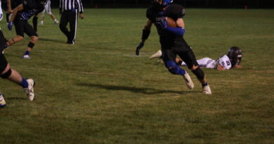 Football players going after the ball