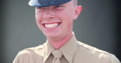 A cadet smiling brightly