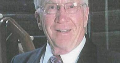 An elderly man in a grainy image